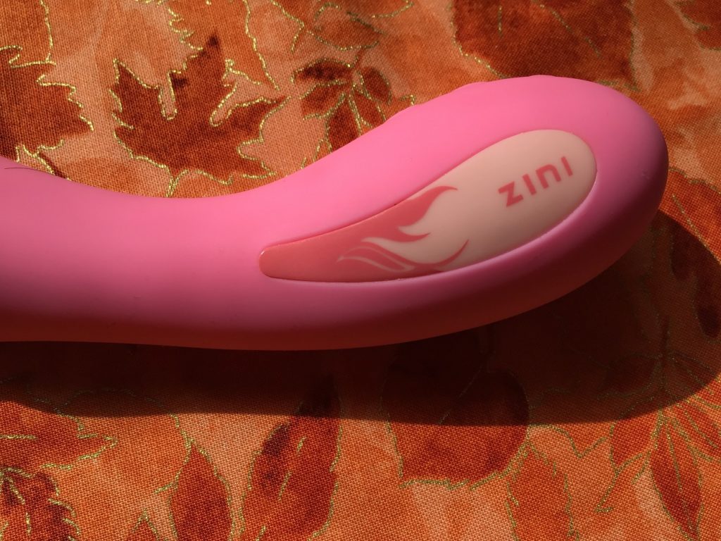 The logo on the handle, which has flames on one side and the word ZINI on the other