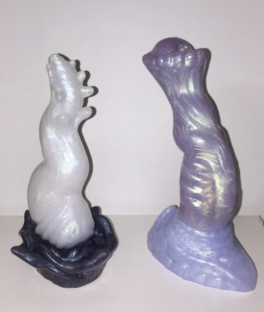 Both are very shimmery split pours. Alraune has a white shaft and midnight blue base, while Kirin has a lavender shaft and lilac base.