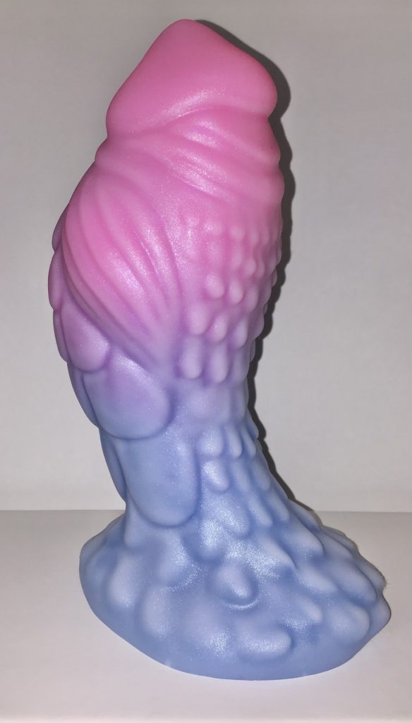 A top-heavy avian model with feather-like bumps and wing-like muscles. It's a fade of pink to blue with a sparkly white highlight.